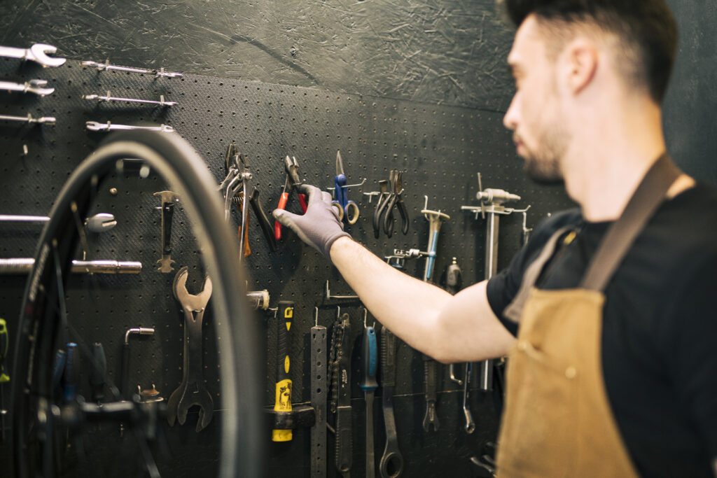 mechanic repairing bicycle
